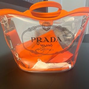 Authentic Prada orange Clear plastic beach tote used once. Sold as is